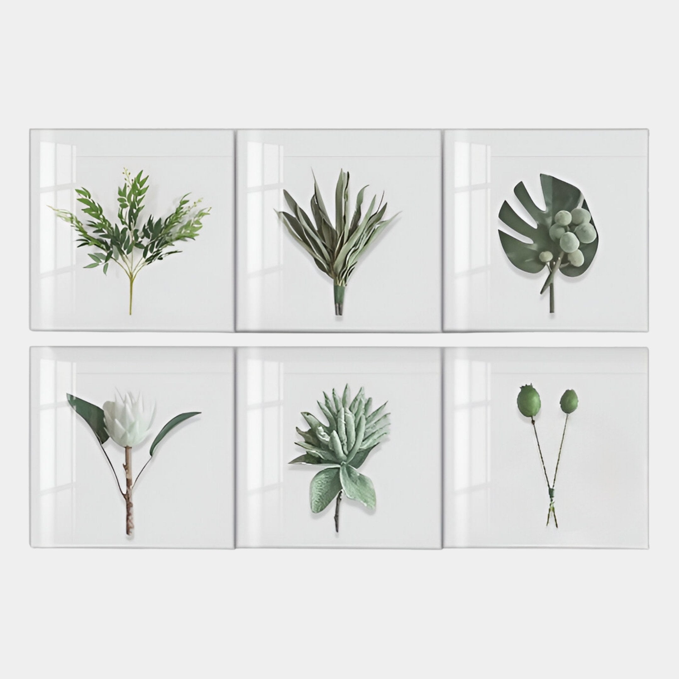 The Florvara Botanical Leaves 6-Panel Clear Acrylic 3D Wall Art by Giant Sculptures features six minimalist green plant designs, perfect for creating a natural décor statement on your wall.