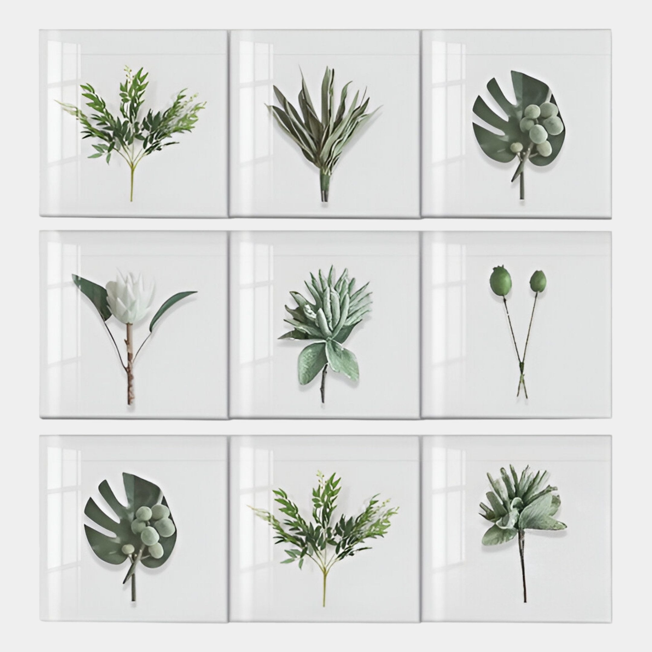 The Florvara Botanical Leaves 9-Panel Clear Acrylic 3D Wall Art by Giant Sculptures features nine white square frames, each showcasing a unique green plant, forming a 3x3 minimalist grid—ideal for botanical decor lovers.