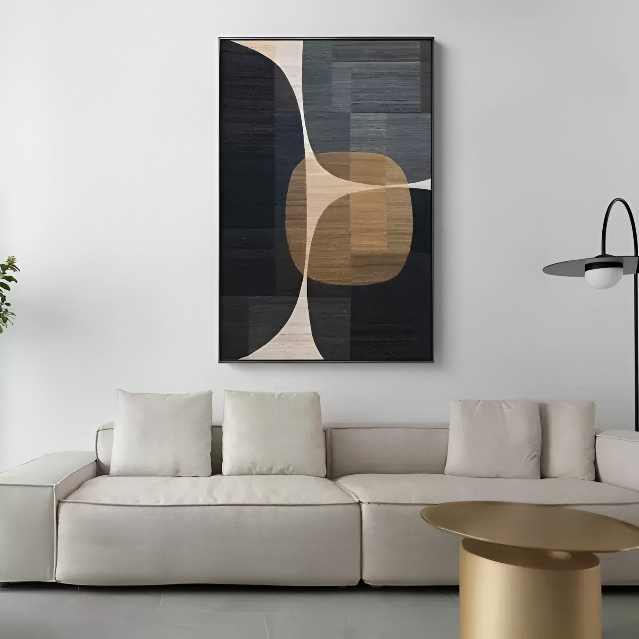 A modern living room featuring a beige sectional sofa, round gold coffee table, tall floor lamp, and the Striatura Navy & Sandstone Rope Abstract 3D Wall Art by Giant Sculptures as contemporary wall decor above the couch.