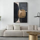 A modern living room featuring a beige sectional sofa, round gold coffee table, tall floor lamp, and the Striatura Navy & Sandstone Rope Abstract 3D Wall Art by Giant Sculptures as contemporary wall decor above the couch.