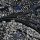 The Noctyra Midnight Flow Abstract 3D Wall Art by Giant Sculptures features scattered white and blue mosaic elements on a black background, intersected by curved silver lines for a dynamic, flowing effect.