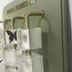 The Aurelian Butterfly Display Acrylic 3D Wall Art by Giant Sculptures features transparent boxes—one with a black butterfly and others frosted—mounted on brass rods, set against a muted green panel for a museum-inspired decor piece.