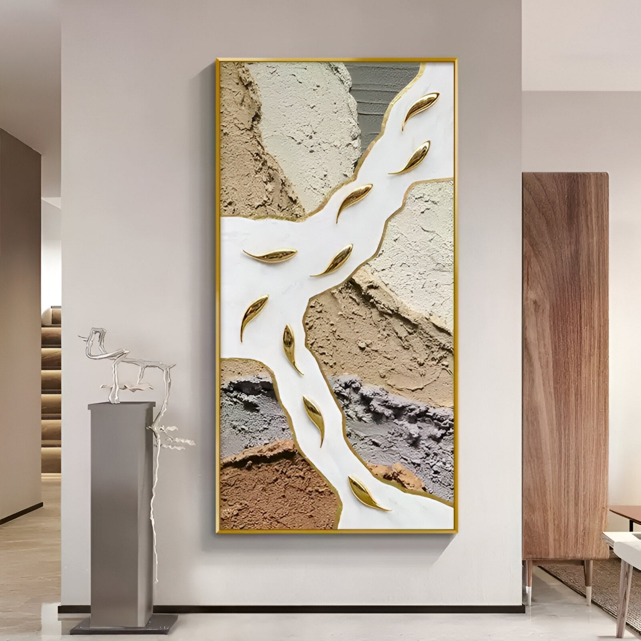 A modern interior wall features the Pisaro Gold Fish Earthy Layers & White Oil Canvas 3D Wall Art by Giant Sculptures, with gold accents and earth tones. Next to it stands a sleek metallic horse sculpture on a tall gray pedestal near stairs and wood paneling.