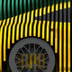 The Velocedra Yellow Sportscar 3D Relief Wall Art by Giant Sculptures features vertical yellow and green slats curving over a textured gray circle, evoking a stylized wheel and fender—ideal motion-inspired decor for dynamic spaces.