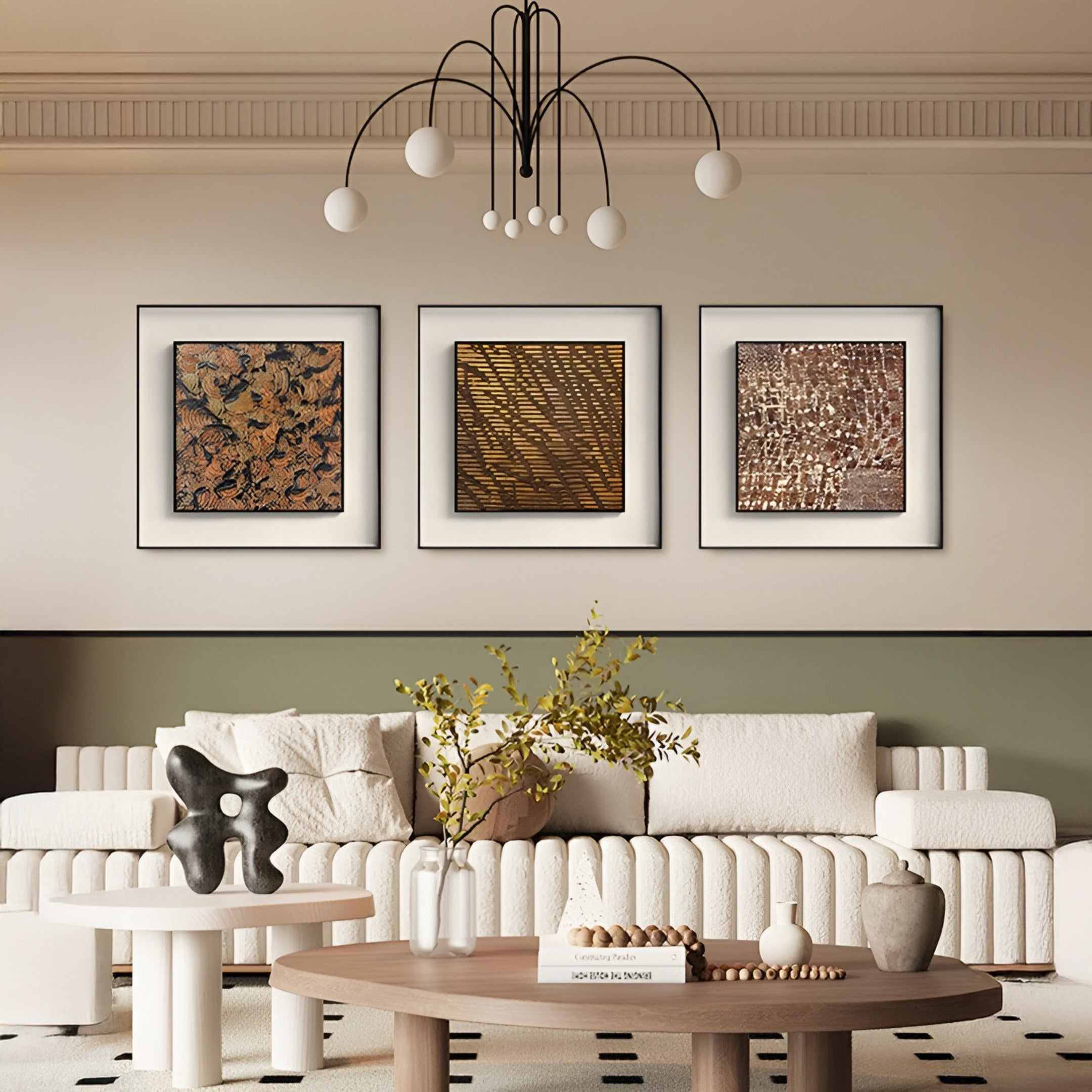 A modern living room featuring a white sofa, round wooden coffee table, sculptural decor, and three Fiorenze Taupe & Brown Grid Textured Square 3D Wall Art pieces by Giant Sculptures. A striking black chandelier hangs overhead.