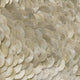 Orraya Golden Shell Disc Layered Framed 3D Wall Art by Giant Sculptures features overlapping, iridescent discs in cream and light gold, arranged in a scale-like pattern for a shimmering, textured golden wall accent.