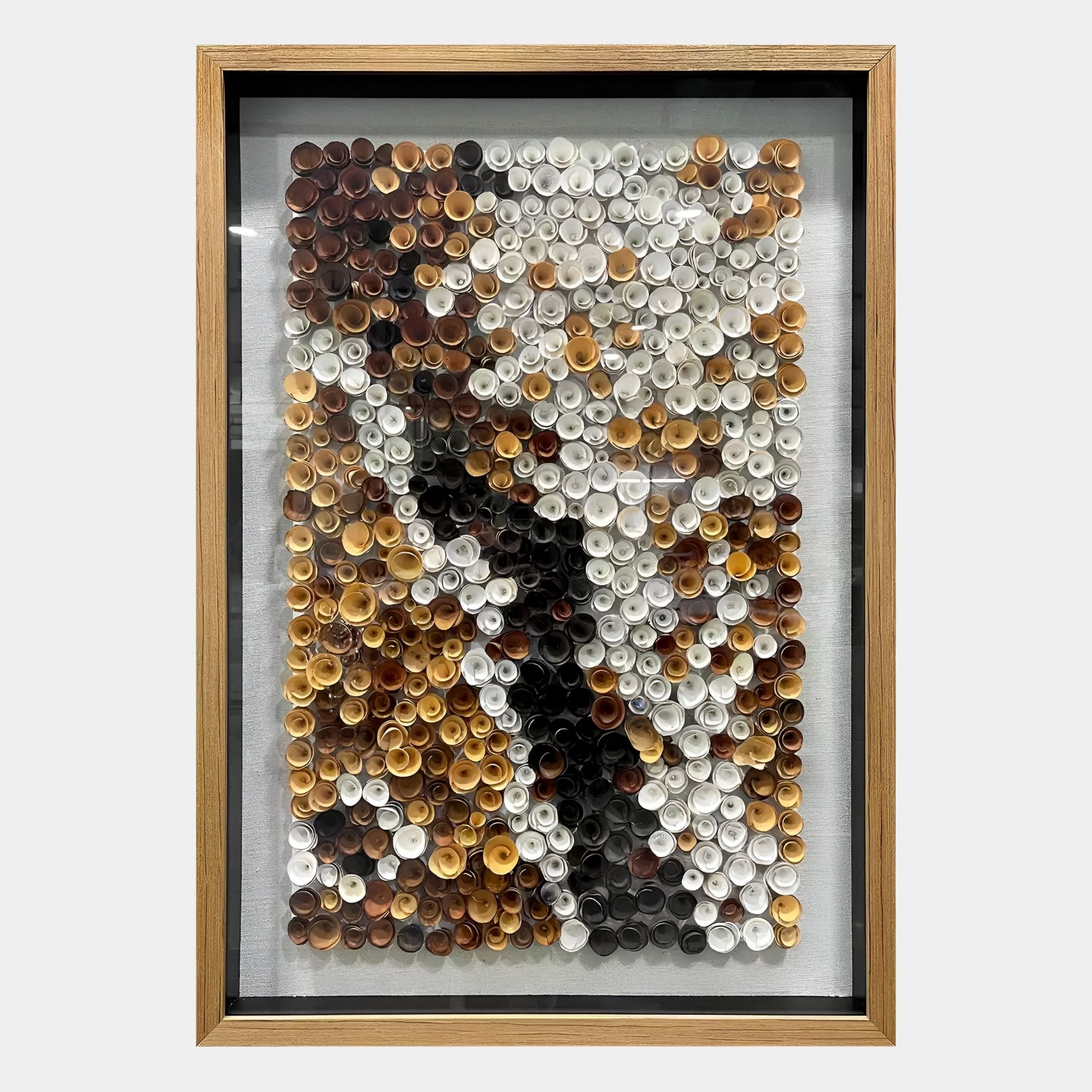 The Volaris Ochre & Ivory Rolled Floral Framed 3D Wall Art by Giant Sculptures features rolled paper in brown, white, black, and tan creating an abstract texture within a handmade wooden frame and glass cover.