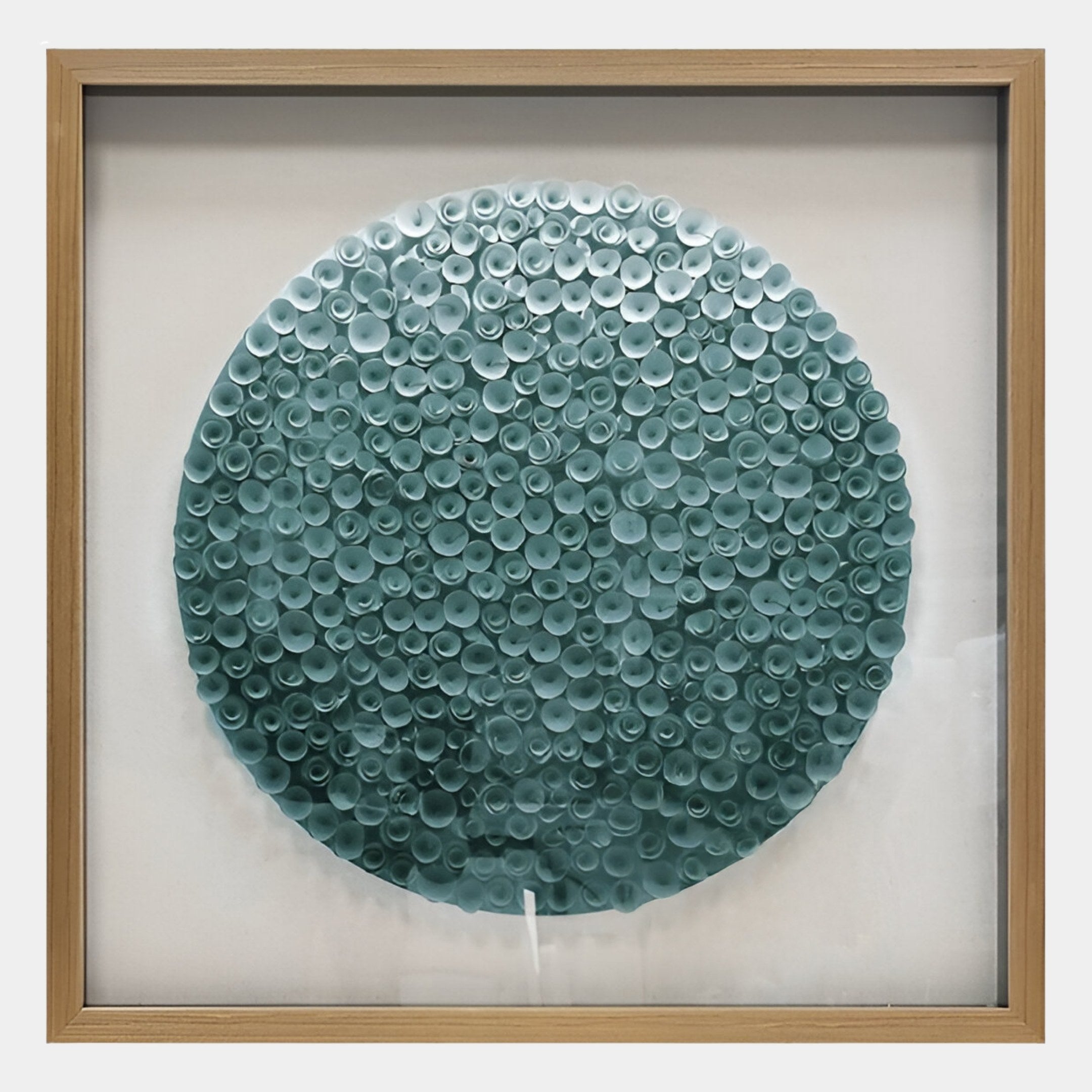 The Aureliare Teal Blue Rolled Floral Framed 3D Wall Art by Giant Sculptures features intricate teal paper curls arranged into a bold circle on white—an eye-catching modern piece for your space.