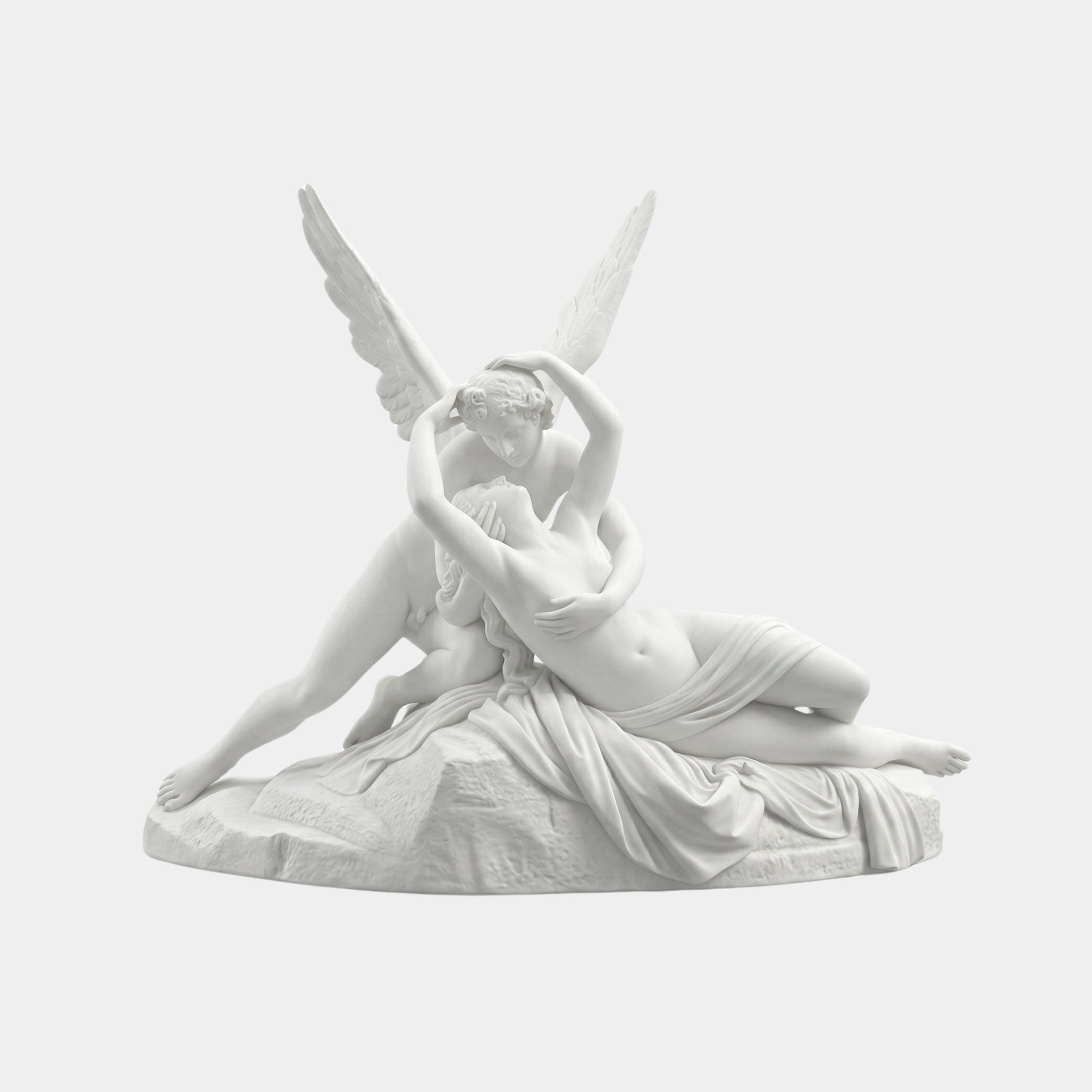 Hand Carved Cupid Angel Marble Outdoor Sculpture by Giant Sculptures showing Cupid embracing Psyche in a reclining pose with outstretched wings, carved in white marble on a plain white background.