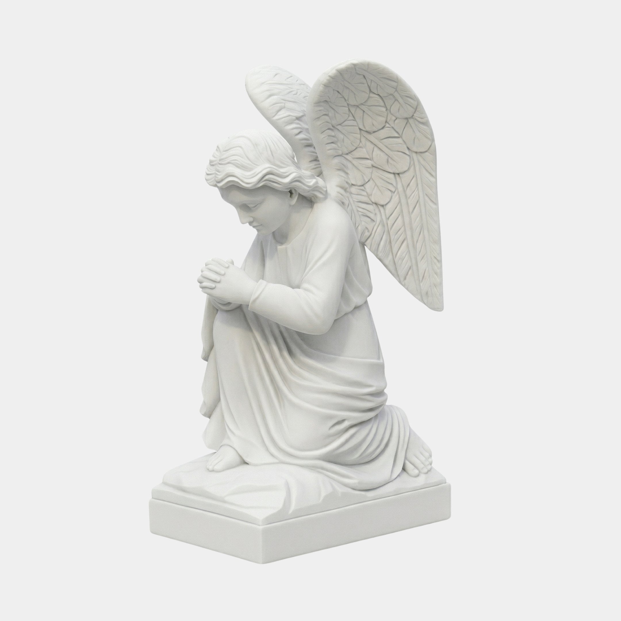 Praying Angel Marble Outdoor Sculpture by Giant Sculptures, depicting a kneeling winged angel with clasped hands and bowed head in white marble on a rectangular base, plain grey background.