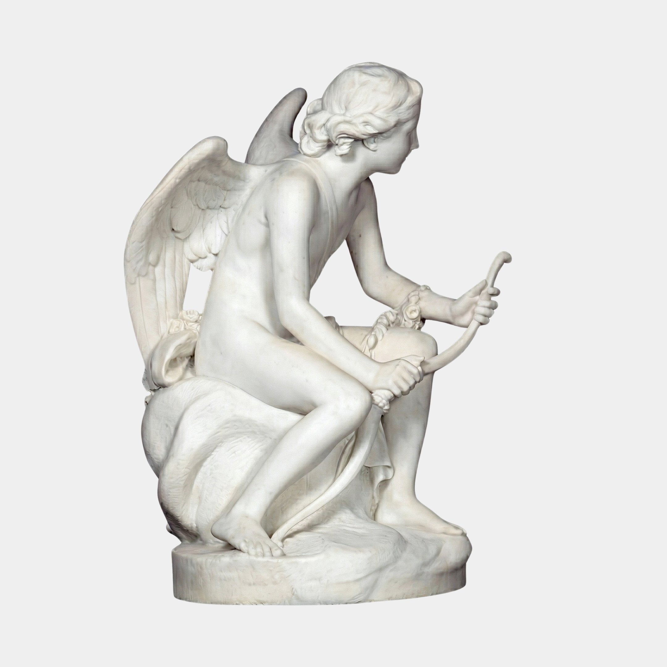 Eros And Snake Cupid Angel Marble Outdoor Sculpture in white natural marble, depicting a seated winged Eros holding a serpent, shown in profile against a plain light background.