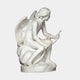 Eros And Snake Cupid Angel Marble Outdoor Sculpture in white natural marble, depicting a seated winged Eros holding a serpent, shown in profile against a plain light background.