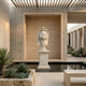 Giant Sculptures Angel Statue Angel Marble Outdoor Sculpture – 180cm white marble winged angel holding a basket on a classical pedestal, displayed in a modern courtyard with succulents and a reflecting pool.