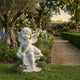 Giant Sculptures Cherub Kneeling Angel Marble Outdoor Sculpture in white marble, seated with wings and lyre, displayed in a lush English garden setting.