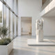Cemetery Weeping Angel Marble Outdoor Sculpture by Giant Sculptures, 150cm white marble figure with bowed head, folded wings, and flowing robes on a marble pedestal in a modern gallery setting.
