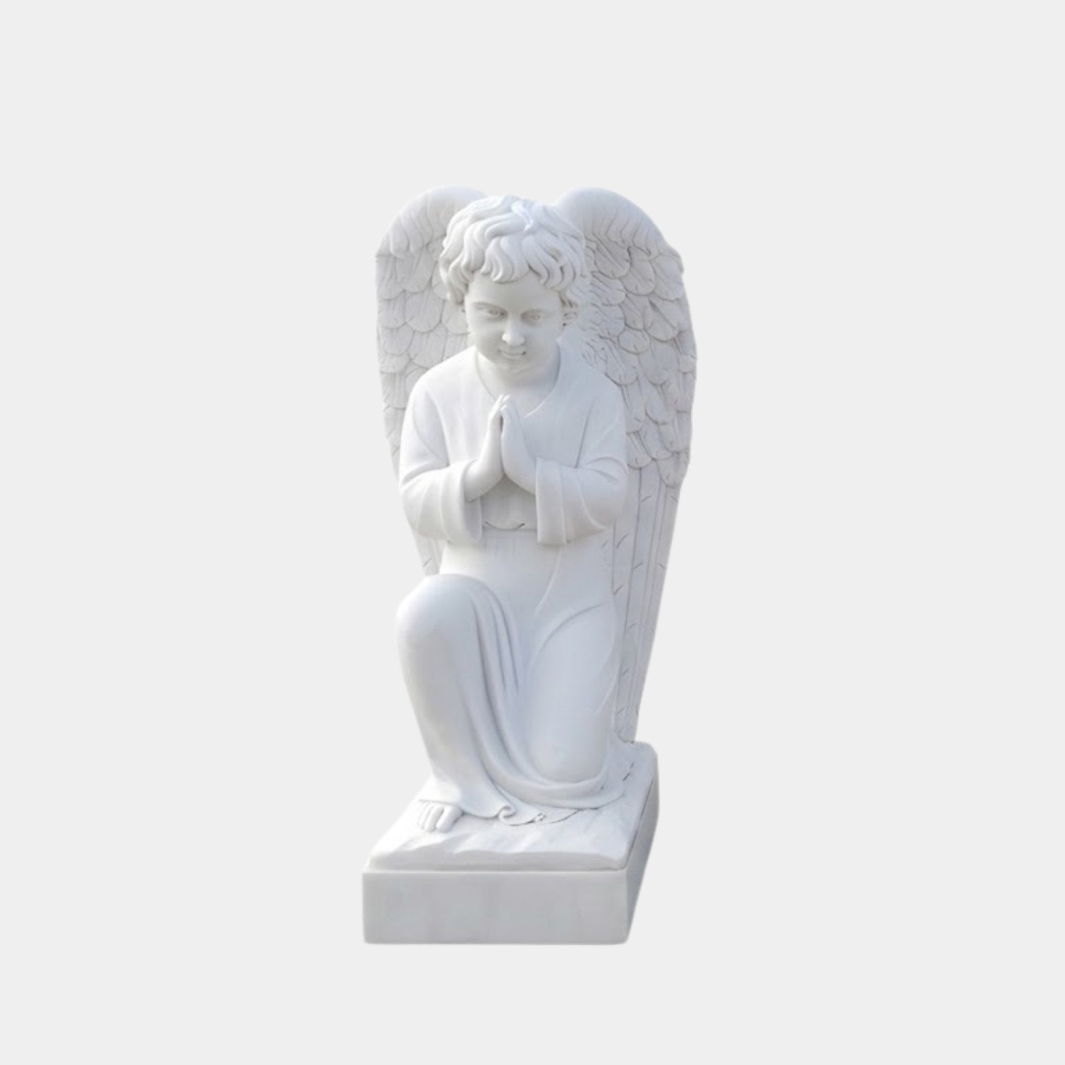 Kneeling Praying Angel Marble Outdoor Sculpture in white marble, depicting a child angel with unfurled feathered wings and hands clasped in prayer on a square base, against a plain light background.