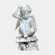 Seated Cherub Angel Marble Outdoor Sculpture by Giant Sculptures, 60cm white marble Puck figure cross-legged on mushrooms, against a plain grey background.
