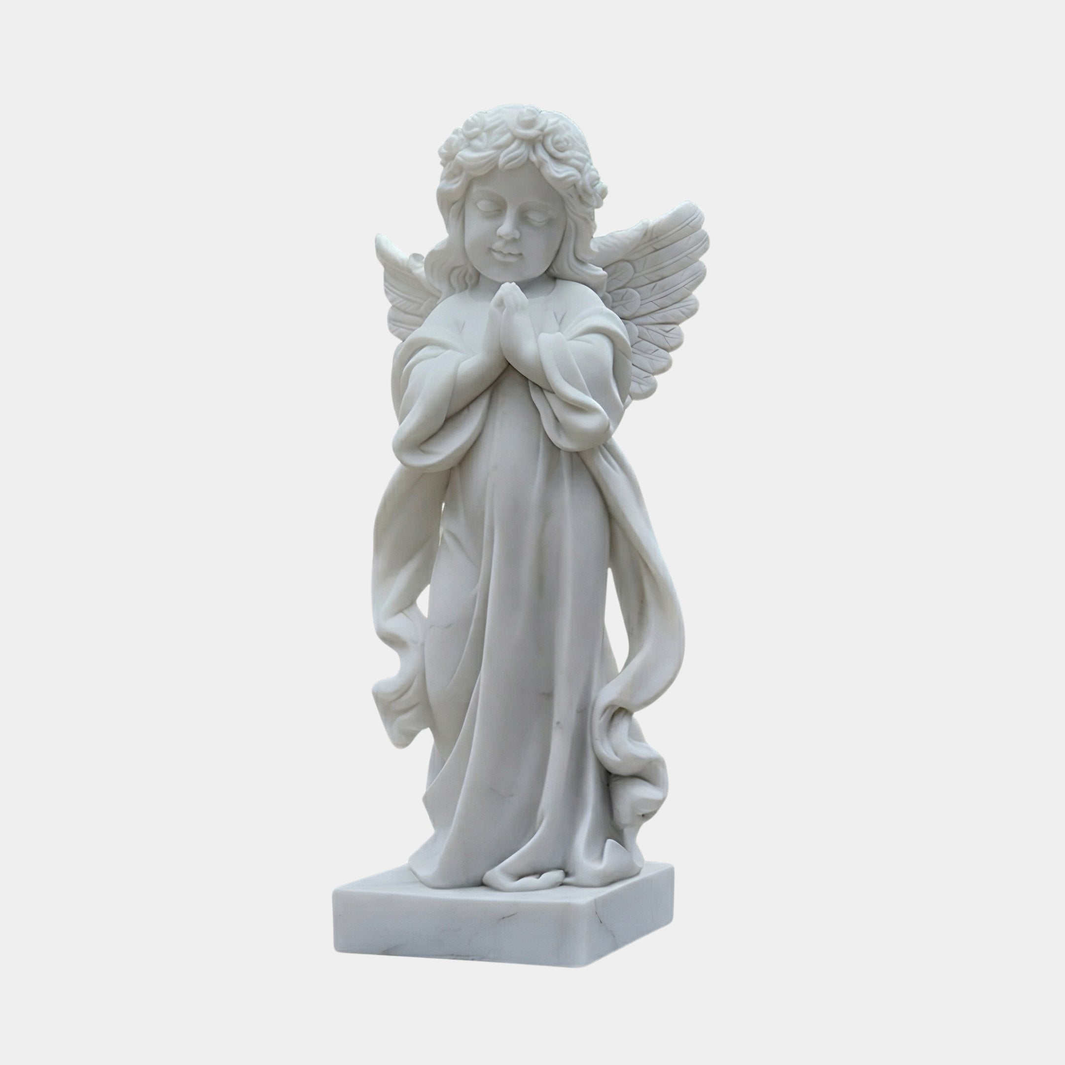Little Girl Angel Marble Outdoor Sculpture – 80cm by Giant Sculptures, a white marble praying angel child with curly hair, feathered wings, and flowing robes on a rectangular base, shown against a plain light background.