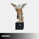 The Gold Life-Size Angel Marble Outdoor Sculpture (225cm) by Giant Sculptures depicts a winged woman in a flowing dress holding grapes and raising one hand, standing on a decorative pedestal. "Version 1" appears in the bottom left on a white background.