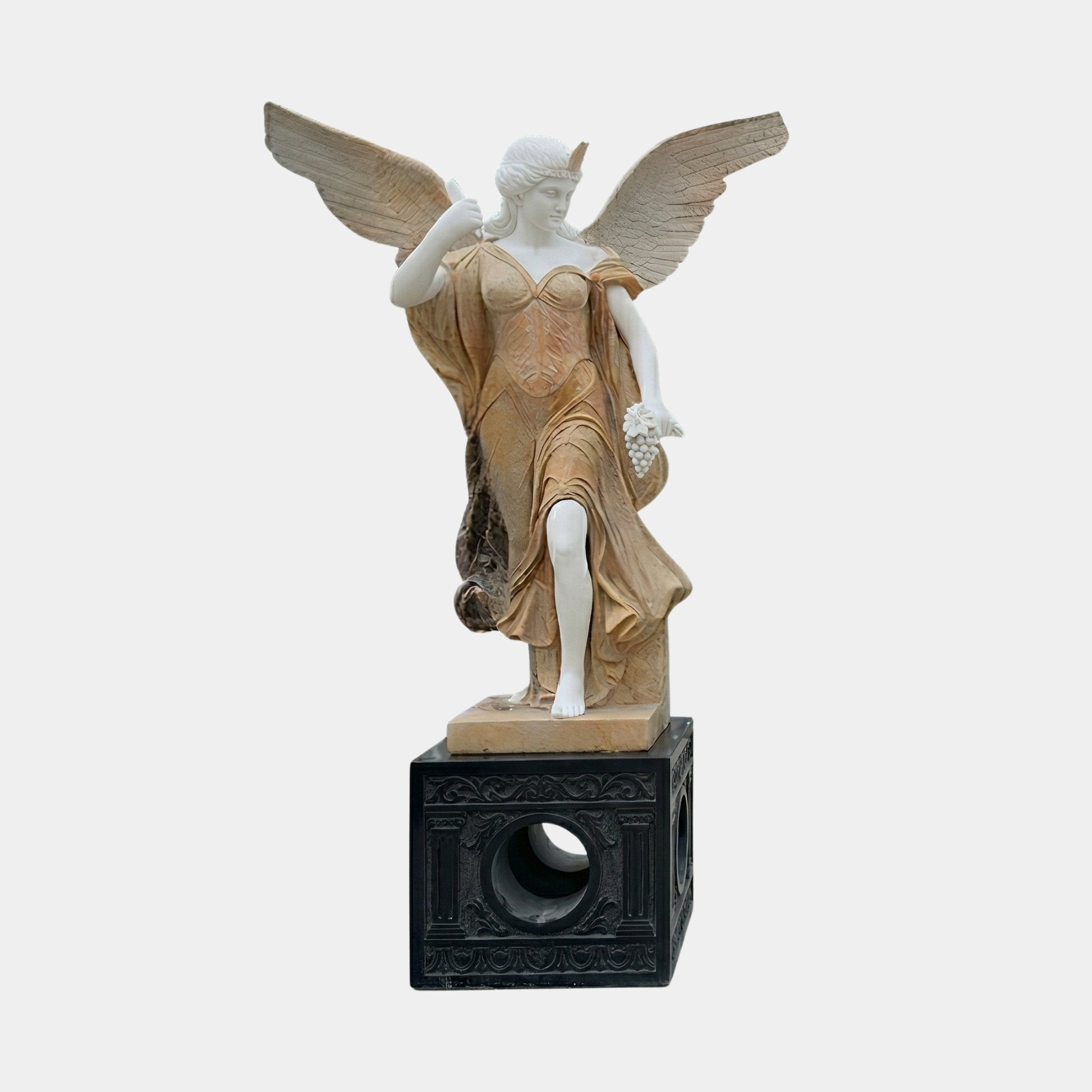 Gold Life-Size Angel Marble Outdoor Sculpture by Giant Sculptures, depicting a winged angel in flowing robes with white and golden two-tone marble finish on a dark ornate base, shown against a plain light background.