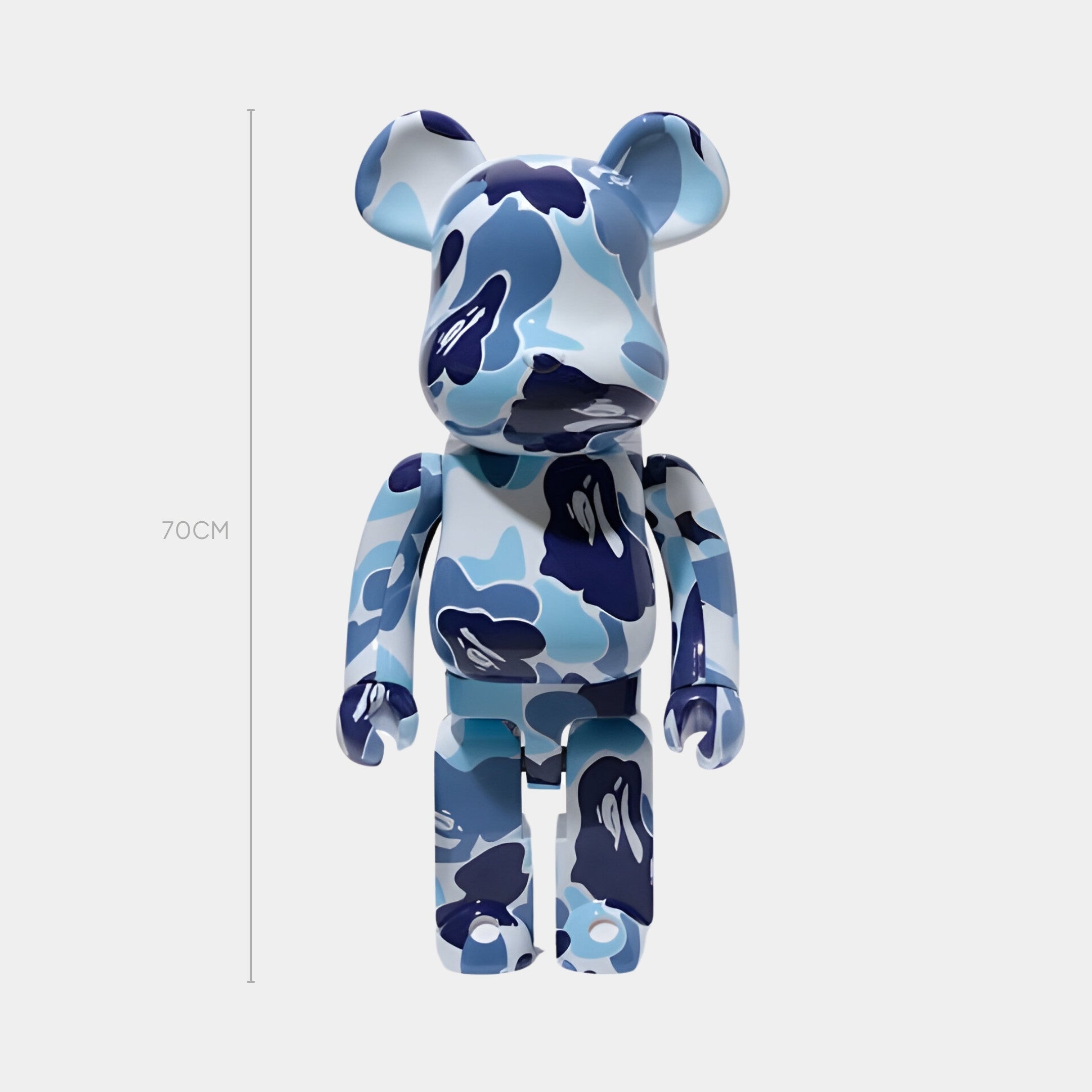 The Giant Sculptures Sapphire Drift Bear Sculpture - 70cm features a glossy blue camouflage finish in various blue and white shades, displayed upright against a plain white background.