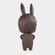 The Monster Freckles Mega Labubu Sculpture - 160cm by Giant Sculptures is shown from the back, displaying its furry dark brown coat, large upright ears, and tan feet with arms at its sides against a white background.