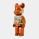 The Metallic Orange Beads Bear Sculpture (70cm) by Giant Sculptures stands upright against a white background, its shiny metallic form and transparent chest filled with colorful beads giving it a contemporary and playful vibe.