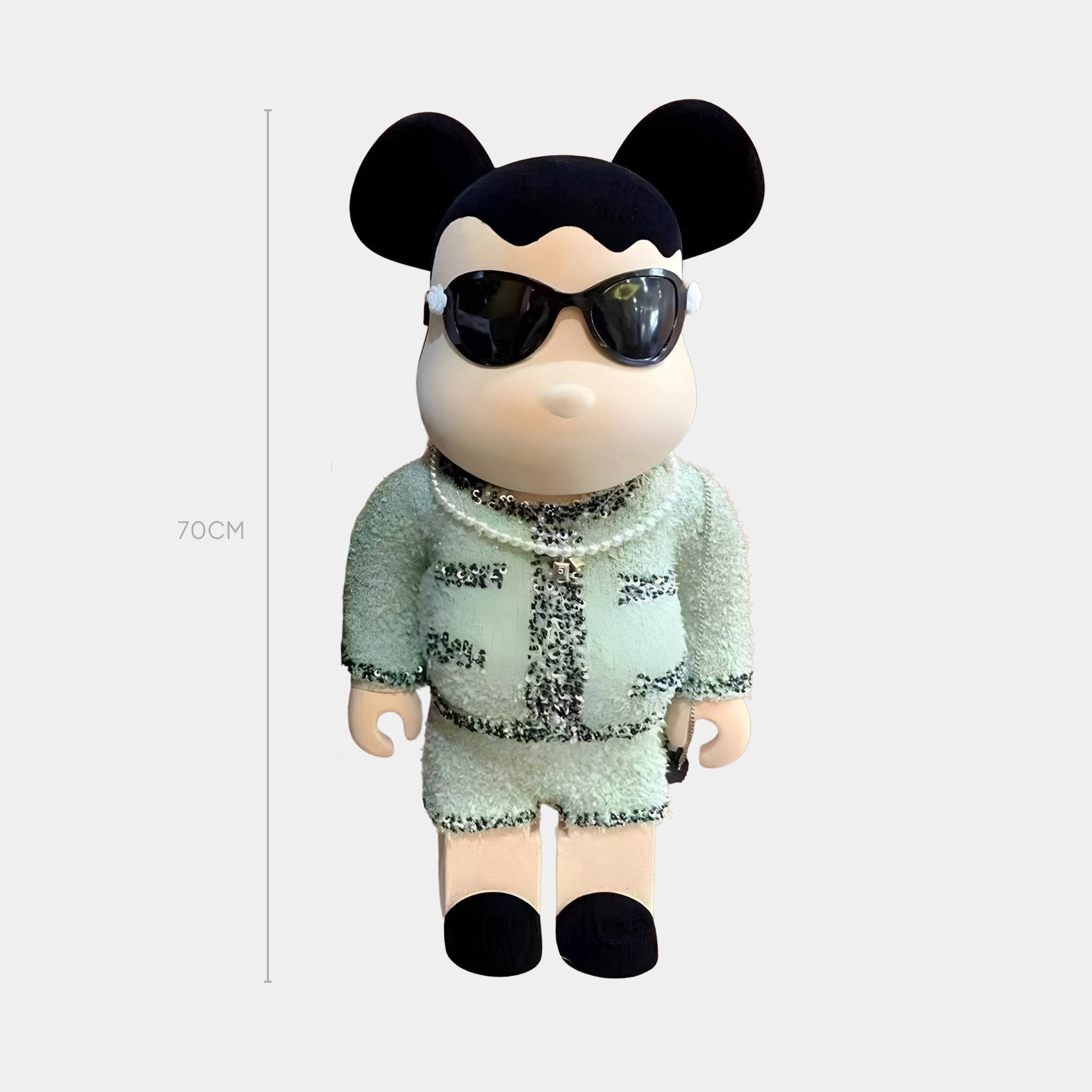 The 70cm Mint Couture Bear Sculpture by Giant Sculptures features black sunglasses and a sparkly mint green outfit with black accents, inspired by a pastel mint palette, standing against a plain white background.