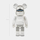 The Mirror Chrome Bear Sculpture - 70cm by Giant Sculptures is a shiny, silver piece with rounded ears, a visor-like blue line across its face, and a reflective surface that highlights sleek, modern artistry.