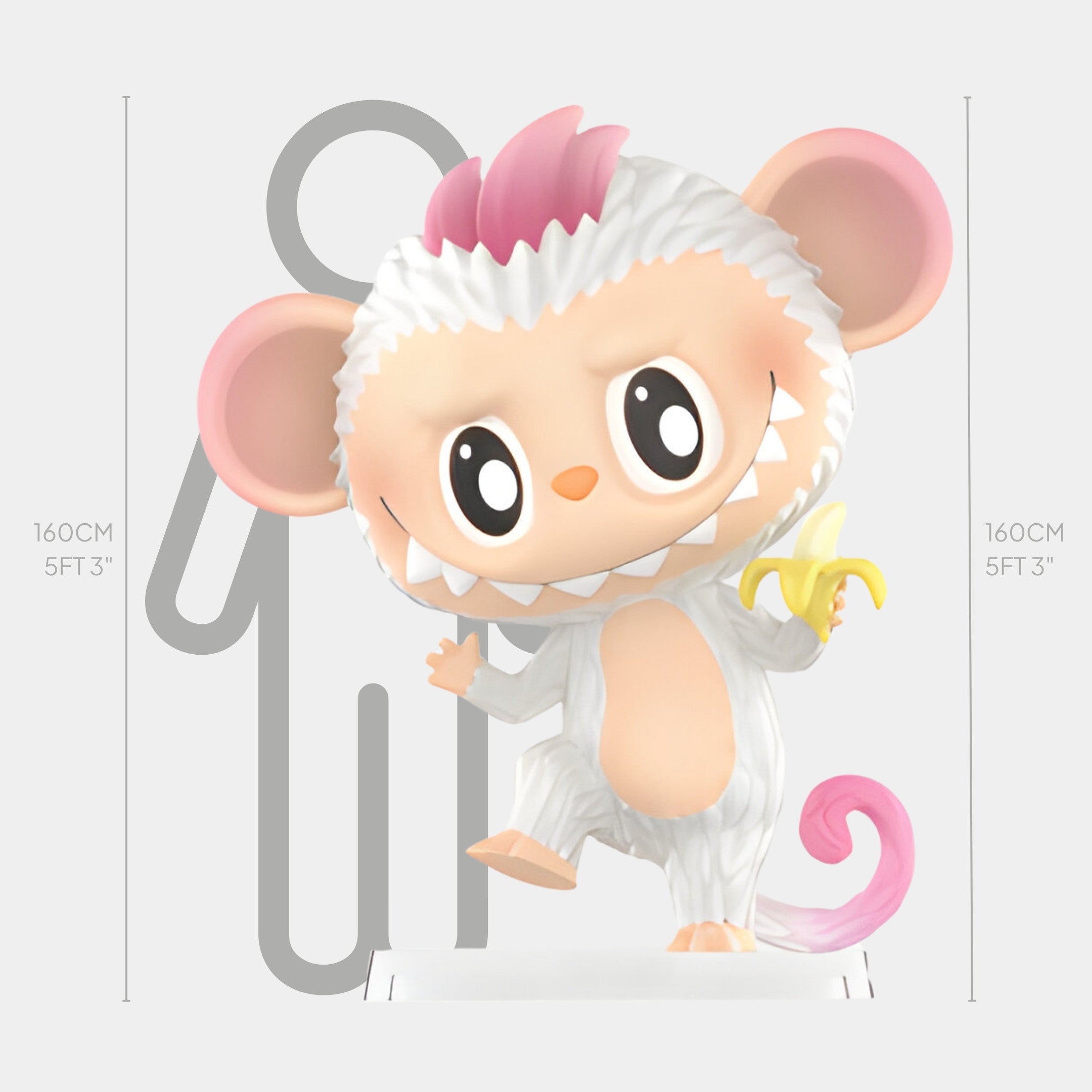 The Animal Monkey Labubu Sculpture by Giant Sculptures stands playfully on one foot, holding a banana. Featuring pink ears and hair, this cute 160cm (5ft 3in) tall cartoon monkey is shown next to a grey human outline for scale.
