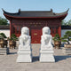 The pair of guardian lions flanking the doors of a lacquered temple hall