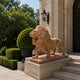 Veined brown marble lion standing with jaws open on its matching slab