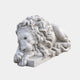 White marble lion asleep with its head resting on crossed forepaws