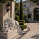 White marble lion asleep with its head on its crossed forepaws