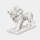 White marble lion standing and roaring in profile on a long moulded slab