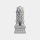 White marble lion seated frontally with a closed mouth and a level expression