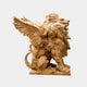 Honey marble winged lion seated with both wings raised and swept back
