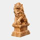 Honey marble lion seated and roaring, a forepaw on a sphere, on a pedestal