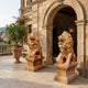 Honey marble lion roaring with its forepaw on a sphere