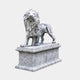 Grey-clouded white marble lion standing on a long moulded pedestal, head raised