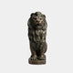 Patinated bronze lion seated square on a round cast disc