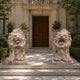 The two veined pink marble lions seated either side of a panelled door