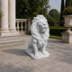 White marble lion seated on its irregular-edged slab, head raised