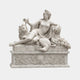 White marble reclining woman leaning against a lion with heaped fruit