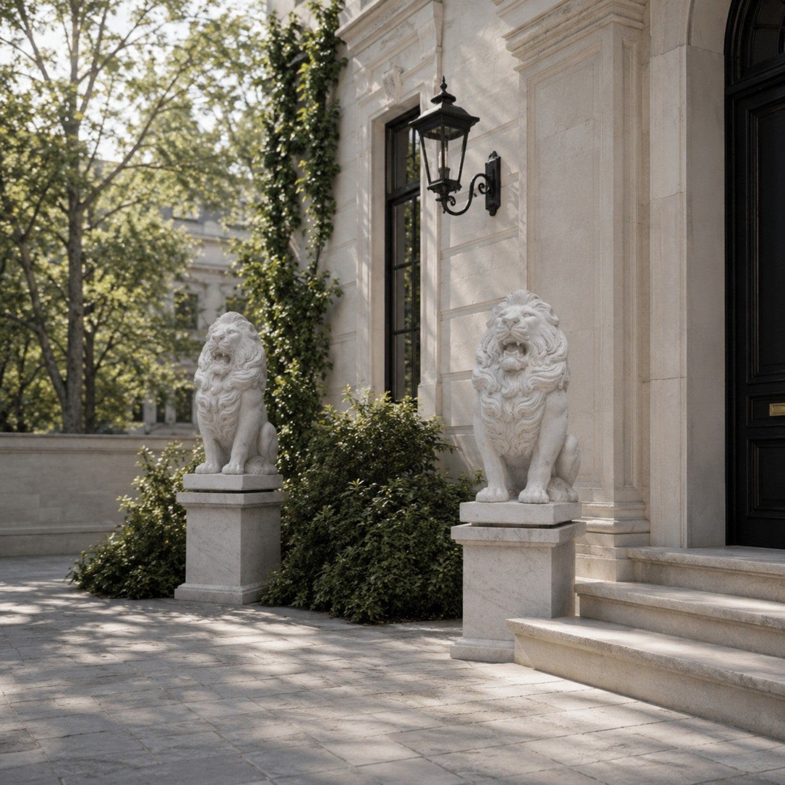 The two seated marble lions on their plain pedestals in a doorway