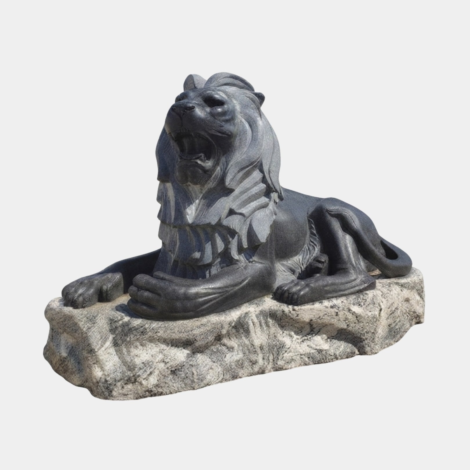 Black marble lion couchant on a rough pale grey rock base