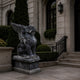 Black marble winged lion seated with one wing raised