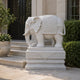 White marble elephant with a key-fret saddle-cloth and beaded headdress
