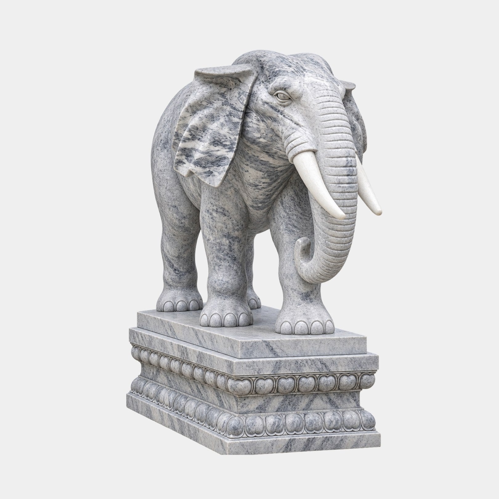 Grey veined marble elephant on a stepped lotus pedestal, ears spread wide