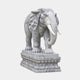 Grey veined marble elephant on a stepped lotus pedestal, ears spread wide